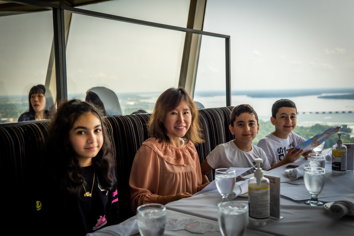 Gina Kim with the Syrian refugee family she supported